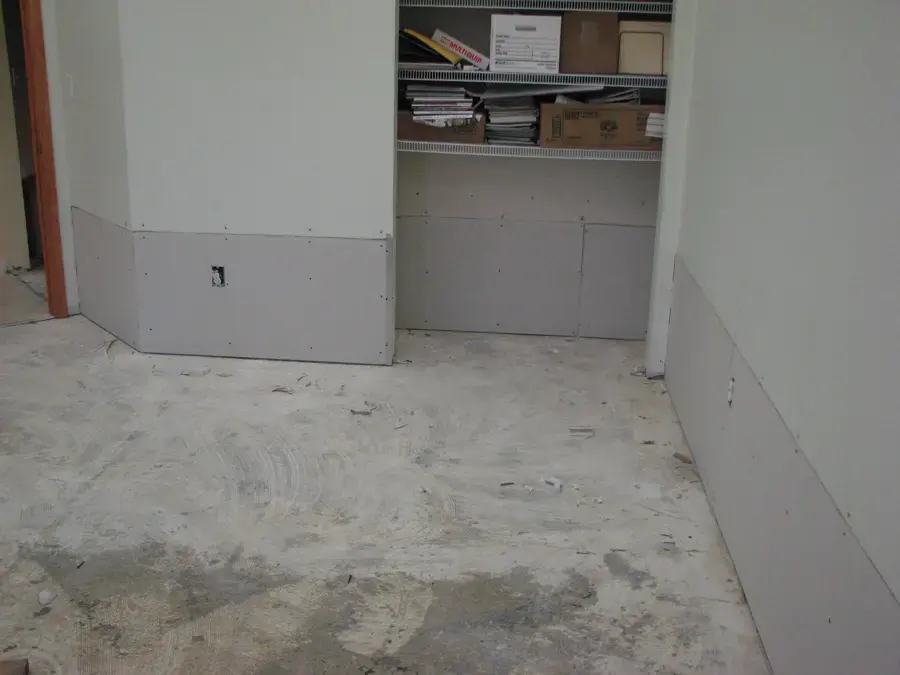 Room in a Lancaster, SC home with the lower drywall cut away so the wall cavities can dry